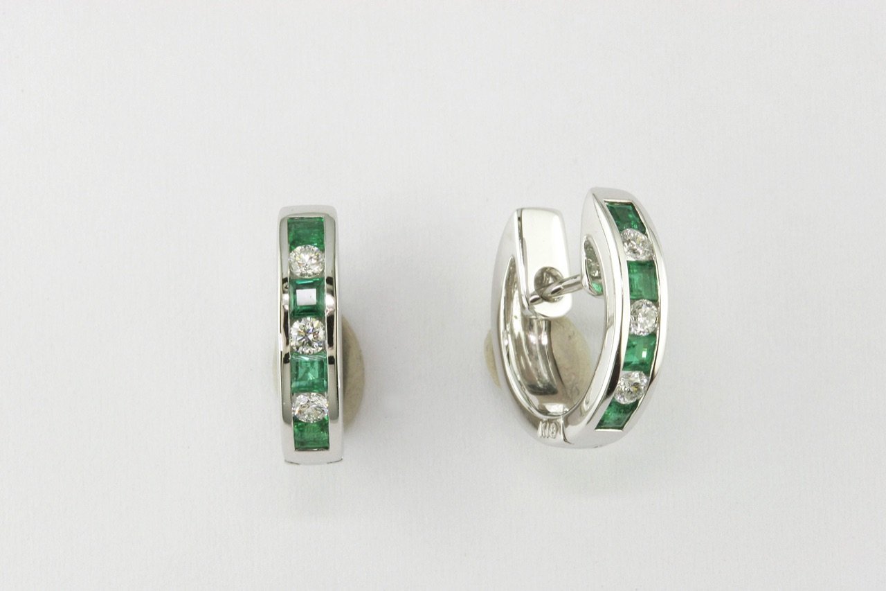 White gold huggie earrings with channel-set emeralds and diamonds