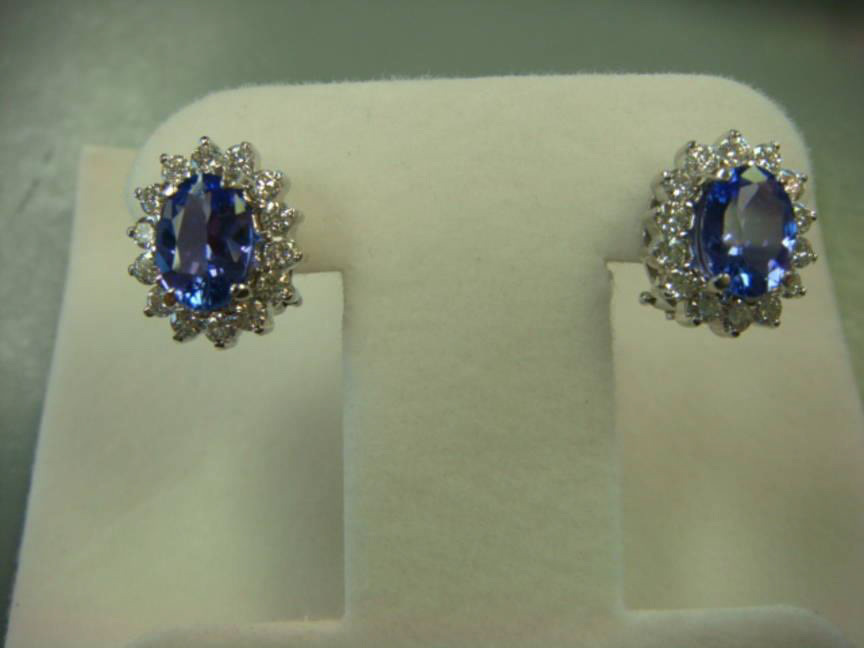 Oval blue sapphire earrings with diamond halos
