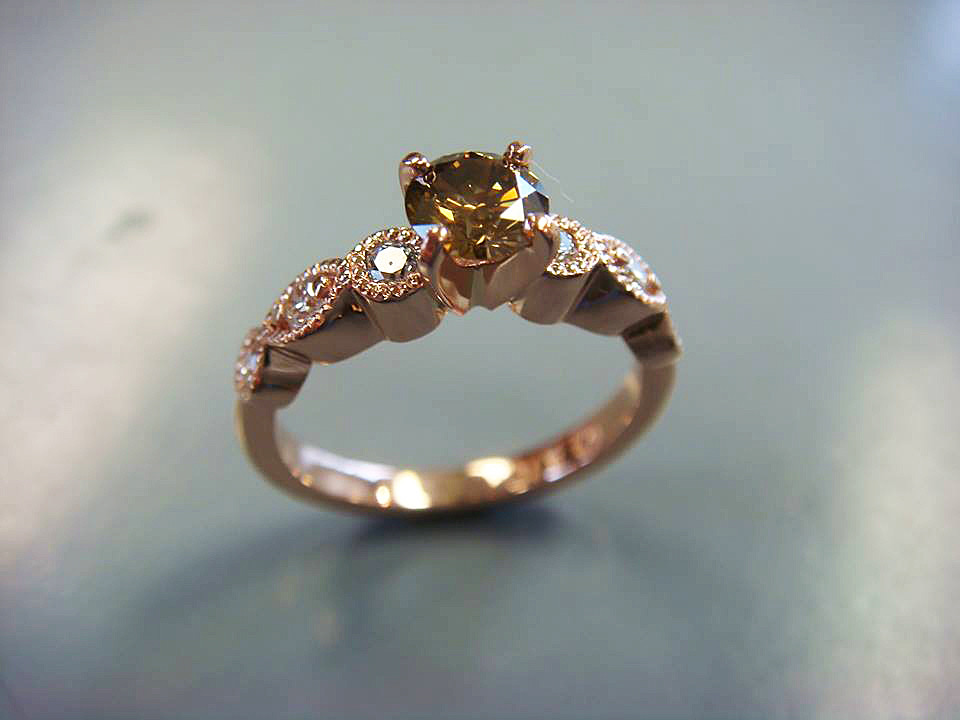 Vintage-style gold ring with milgrain details, the kind of heirloom piece we restore