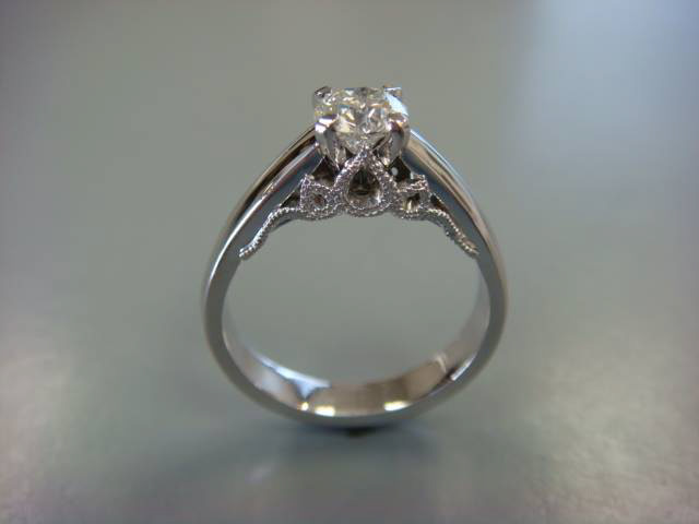 White gold cathedral solitaire engagement ring with openwork filigree