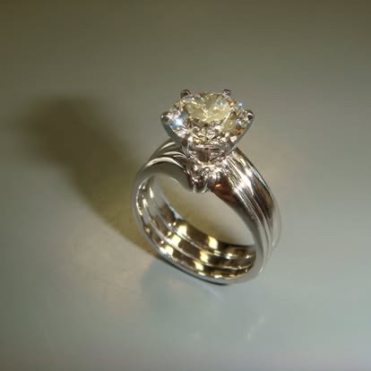 Gold engagement ring with a champagne diamond and interlocking band