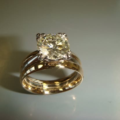 Gold engagement ring with a round champagne diamond and matching band