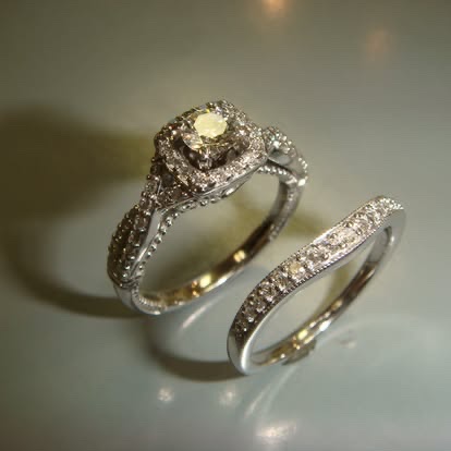 Gold halo engagement ring with a champagne diamond and matching band