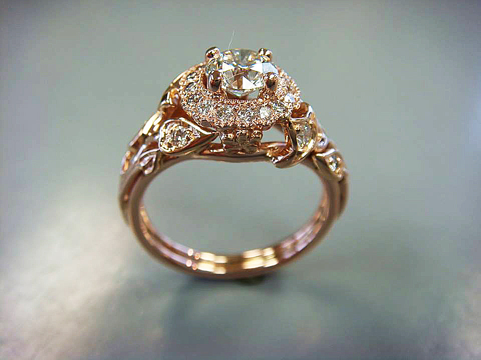 Vintage-inspired gold halo engagement ring with hand-finished filigree
