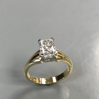 Radiant-cut diamond in a two-tone gold setting