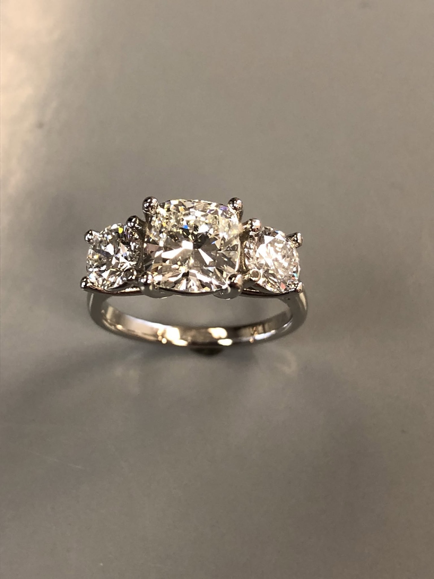 Three-stone diamond engagement ring in white gold