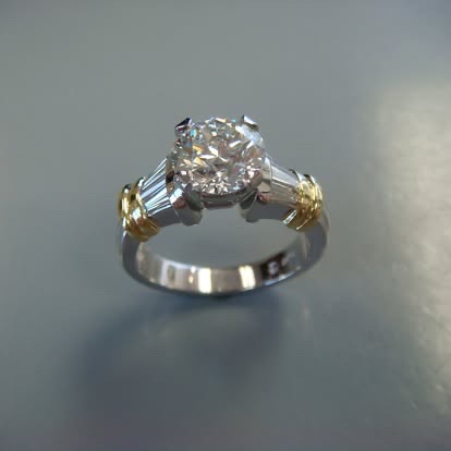 Two-tone diamond engagement ring with baguette side stones