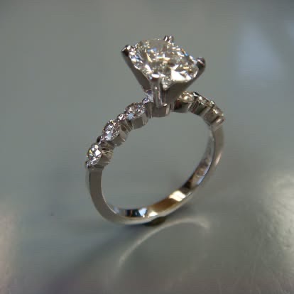 White gold diamond engagement ring with graduated side stones