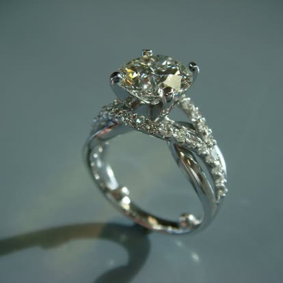White gold diamond engagement ring with a lacy pavé band