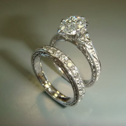 White gold diamond engagement ring with a matching band