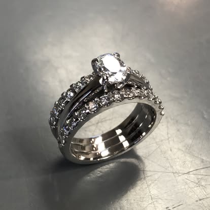 White gold diamond engagement ring with two matching bands