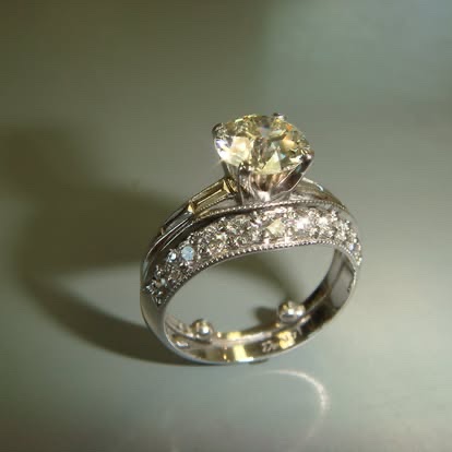 White gold diamond solitaire with a diamond-set band