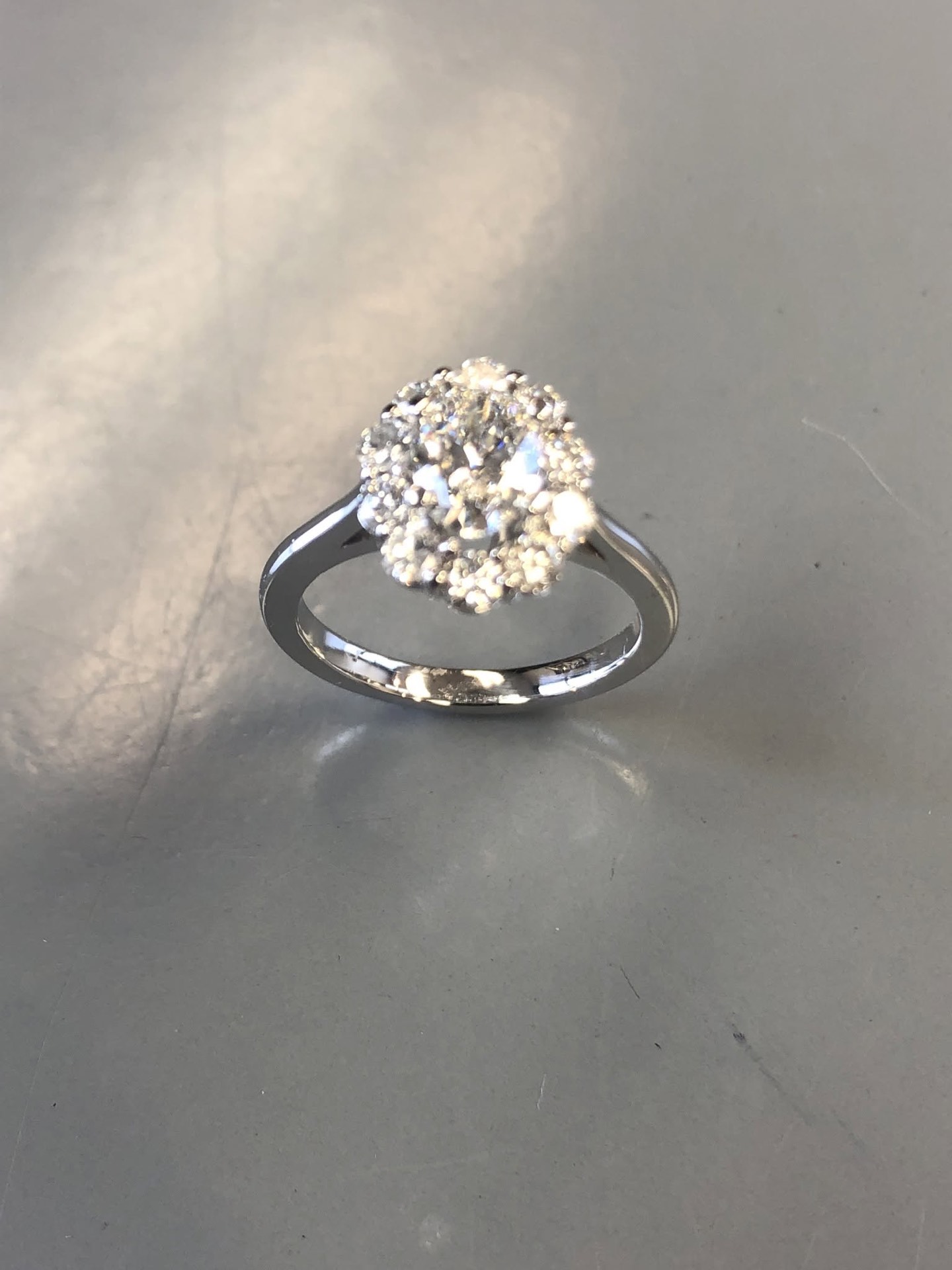 White gold flower-halo diamond engagement ring