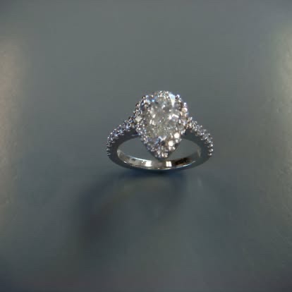 White gold pear-shaped diamond halo engagement ring
