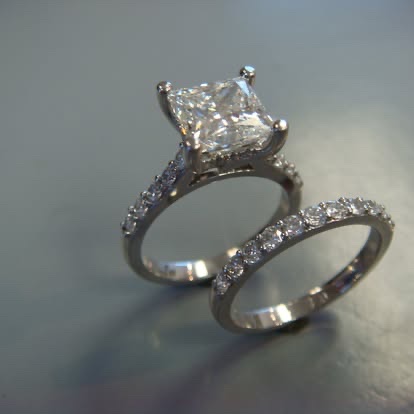 White gold princess-cut diamond engagement ring with a matching band