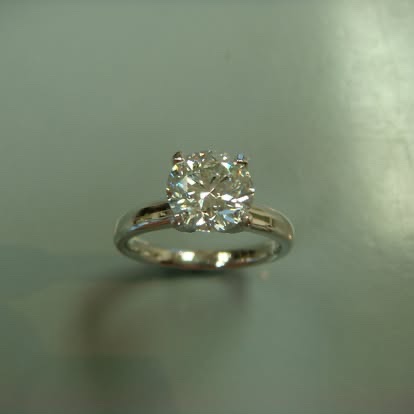 White gold round diamond solitaire with a slim band