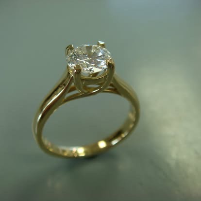 Yellow gold cathedral solitaire engagement ring