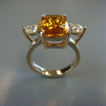 Cushion orange gemstone three-stone ring in white and yellow gold