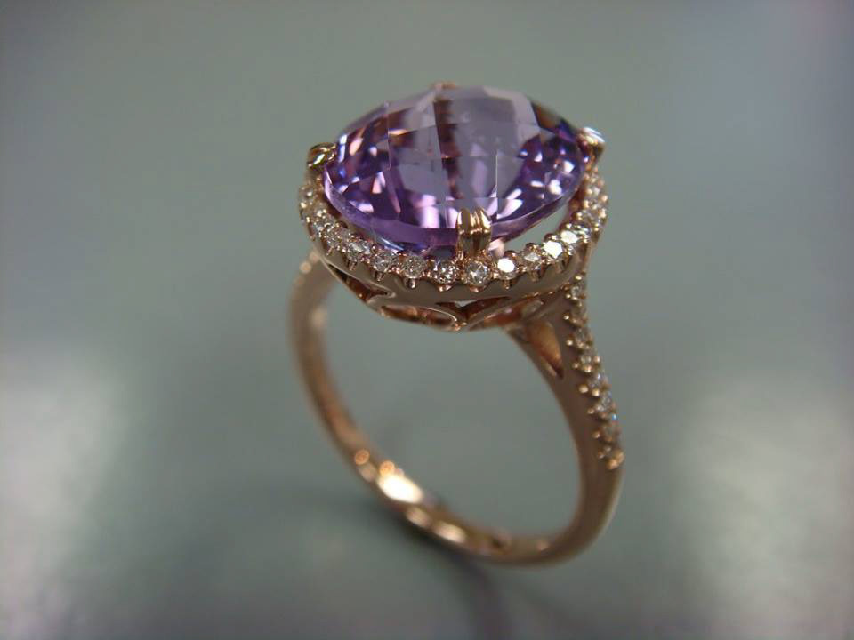 Round lavender gemstone in a gold halo setting