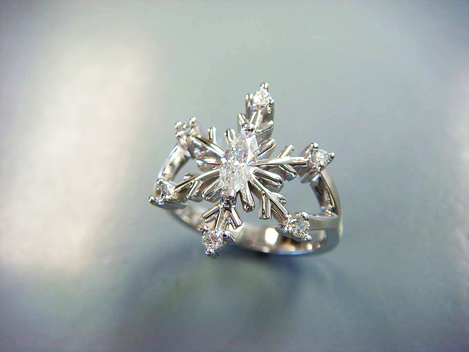 Handmade white gold snowflake ring set with diamonds