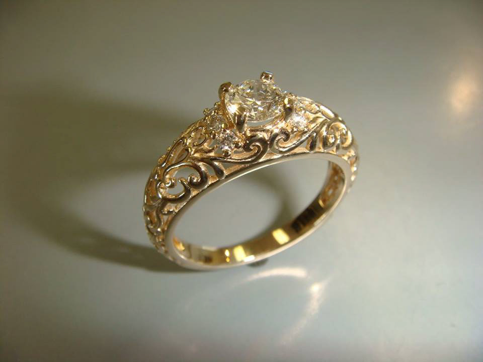 Yellow gold diamond ring with hand-engraved scrollwork