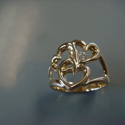 Handmade gold ring with open heart scrollwork