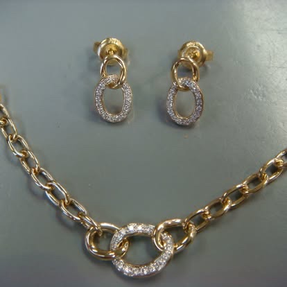 Matching gold link necklace and earrings with diamond accents