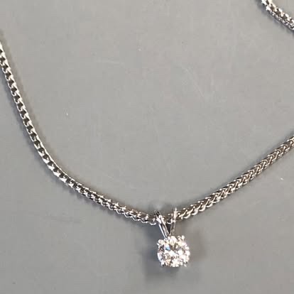 Diamond solitaire necklace on a white gold chain