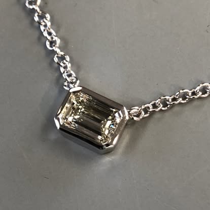 Emerald-cut diamond pendant in white gold