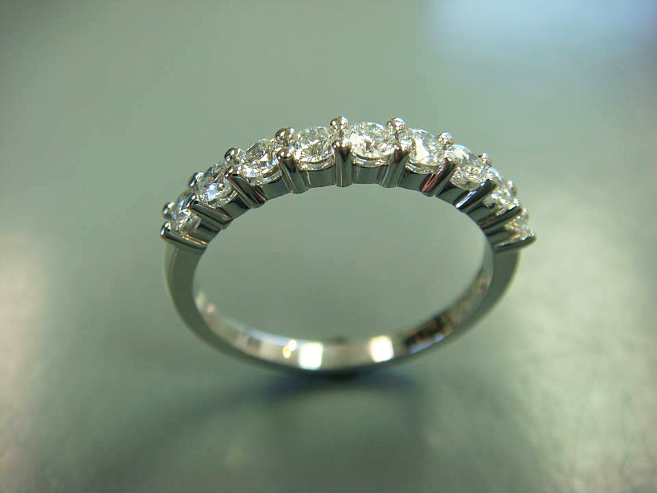 White gold anniversary band with five prong-set round diamonds