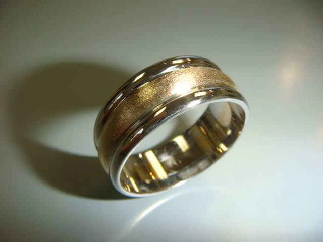 Men's white gold wedding band with a satin center and polished edges