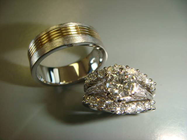 Men's two-tone wedding band shown with a matching diamond bridal set
