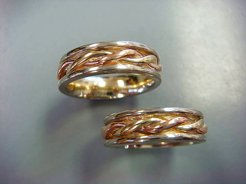 Pair of braided wedding bands in gold and white gold