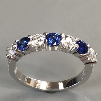 White gold band with alternating sapphires and diamonds