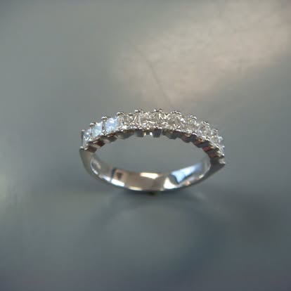 White gold band with a row of diamonds