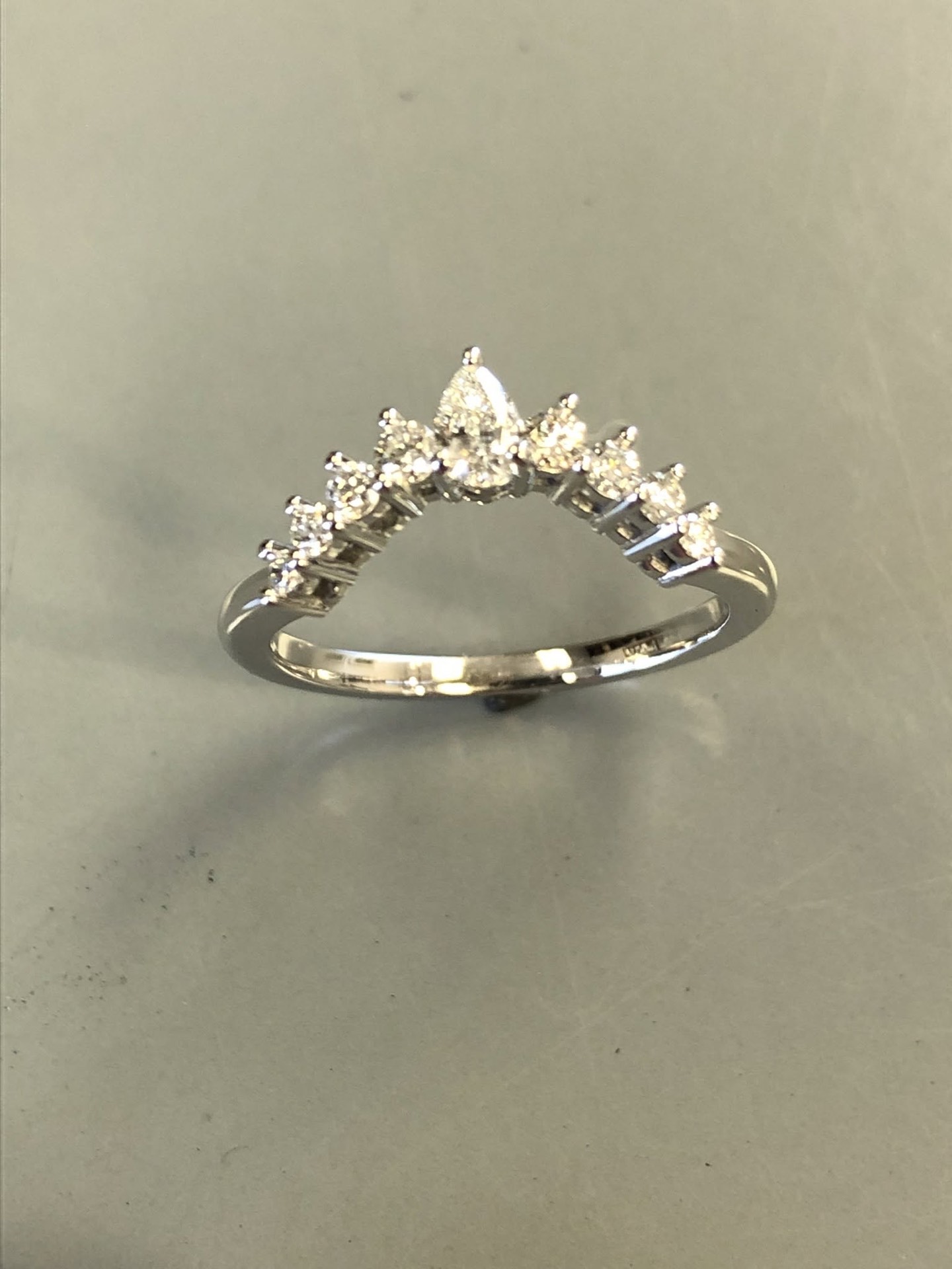 White gold contour band with a chevron of pear and marquise diamonds