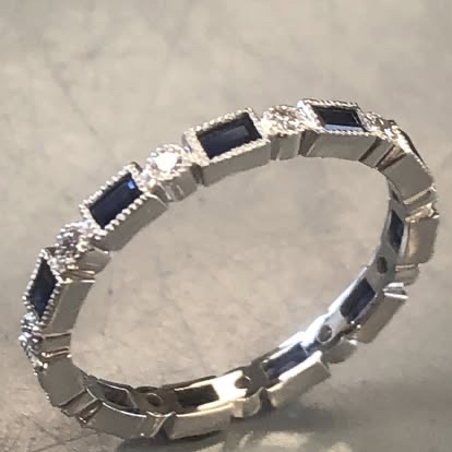 White gold eternity band with alternating sapphires and diamonds