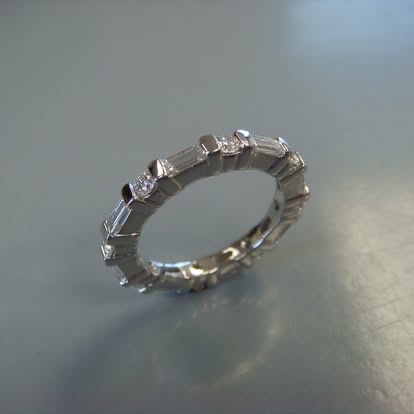 White gold eternity band with baguette and round diamonds