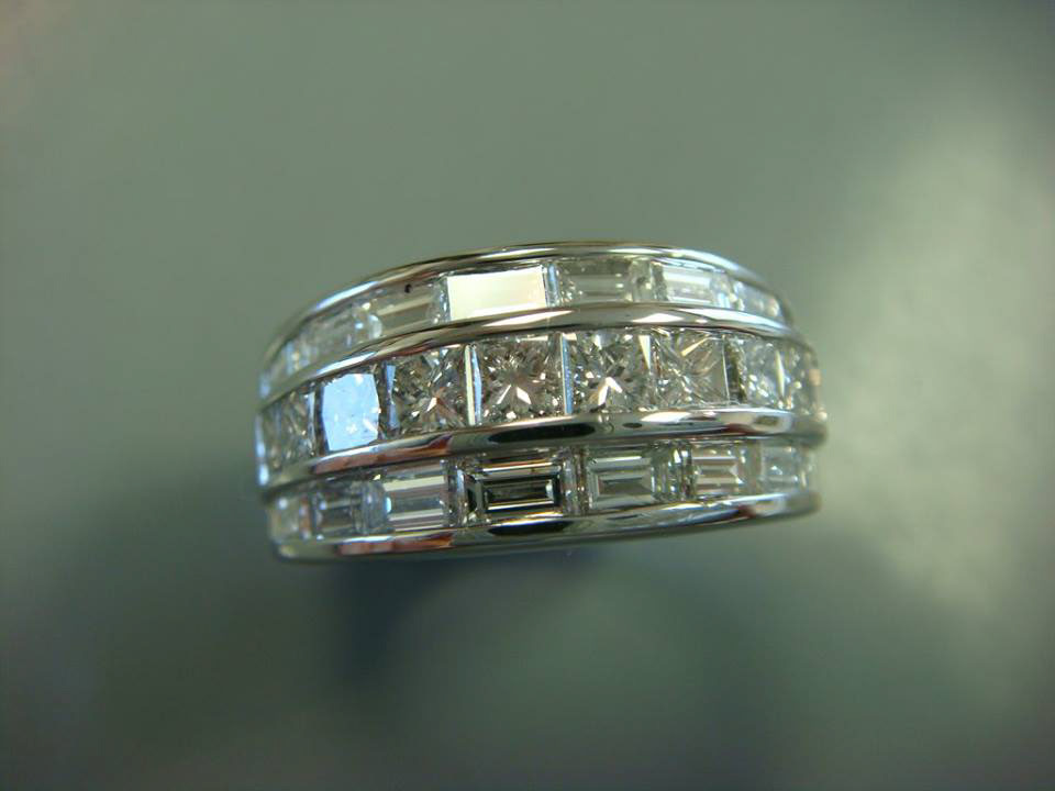 Wide white gold band with rows of baguette and princess-cut diamonds