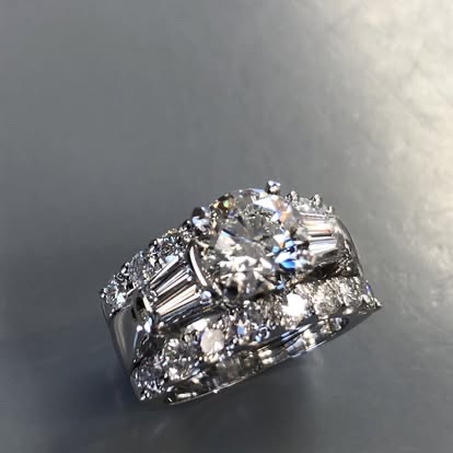 Wide white gold band with baguette and round diamonds